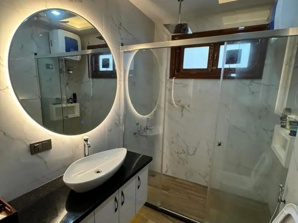Bathroom with backlit mirror